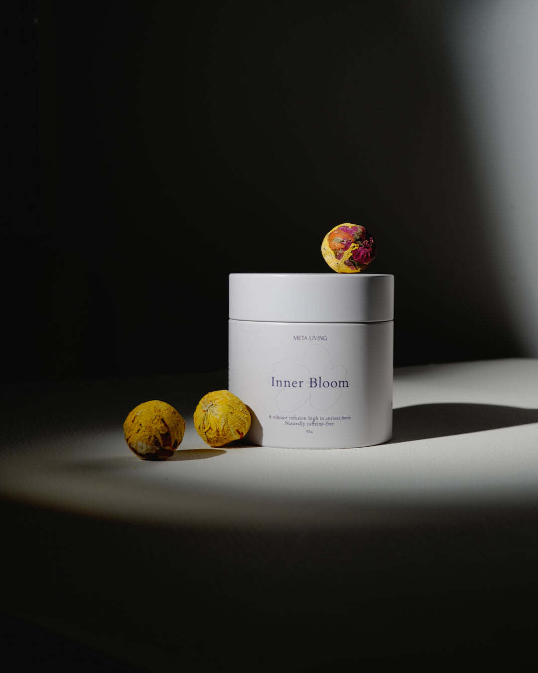 Inner Bloom Tea with the tea ball on display