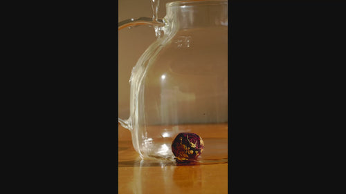 time lapse of evening glow tea being brewed and the tea unfurling